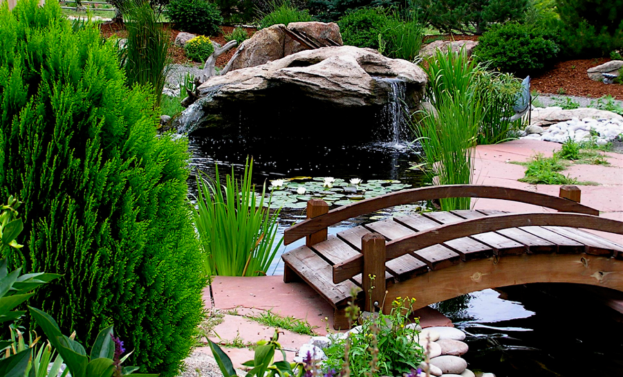 Rocky Mountain Waterscape pond, waterfall and garden bridge