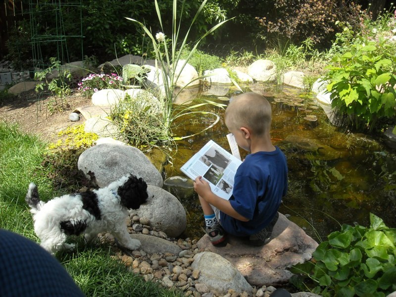 Such fun reading to your pup by the pond!